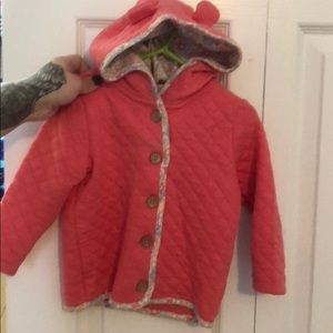 Salmon colored hooded coat with floral trim